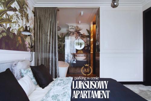 a living room with a couch and a bedroom at Apartament Faltom 6 Yacht Park Premium in Gdynia