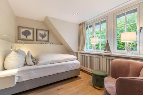 Postel nebo postele na pokoji v ubytování Inselliebe Exklusive Sylter Wellnessoase mit Sauna Garten in Keitum