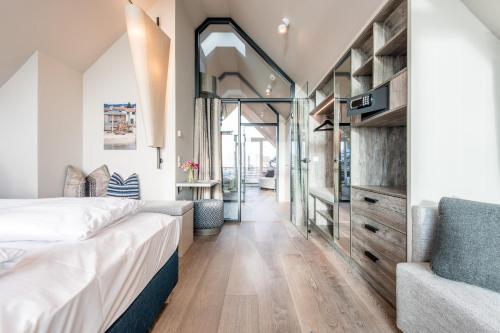 Un pat sau paturi într-o cameră la NEU! HAFEN27, No 10 - exklusiv urlauben mit Wattblick in List auf Sylt