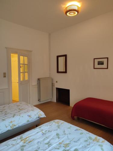 Кровать или кровати в номере Les chambres de Preisch