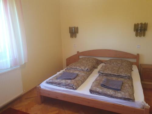 Postel nebo postele na pokoji v ubytování Somogyfajsz
