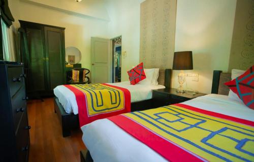 Postel nebo postele na pokoji v ubytování Zantiis Ndol Villas