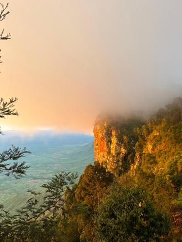 a view of a mountain in the clouds at Uvi House & Restaurant in Mntindili