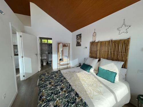 Katil atau katil-katil dalam bilik di Chalet Abacates
