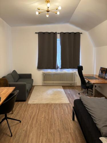 a living room with a couch and a table at 2 Zimmer Wohnung an der Isar in Munich