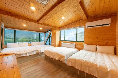 Una cama o camas en una habitación de 峰樹屋