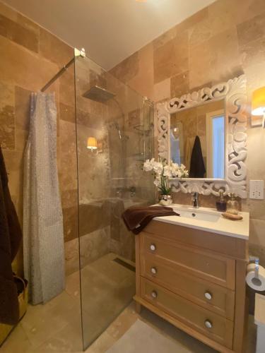 a bathroom with a sink and a shower at St Julians Luxurious Penthouse with POOL Enjoying Distant SEAVIEWS in St Julian's