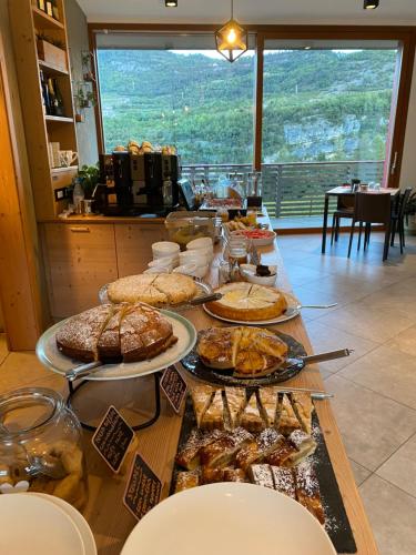 a buffet with many different types of food on a table at Agritur Verderame in Trento