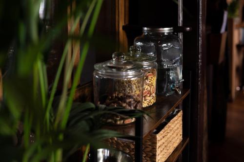 a shelf with jars of food on it at The Crown Inn in Bishops Waltham
