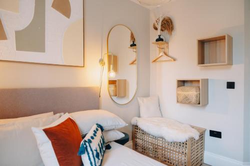 a living room with a couch and a chair at 1 Bed Apartments - Central Bath in Bath