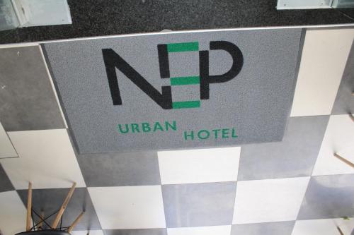 a sign for a hotel on a tile floor at N E P center Hotel Rodos in Rhodes Town