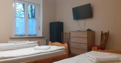 En eller flere senge i et værelse på Kamienica