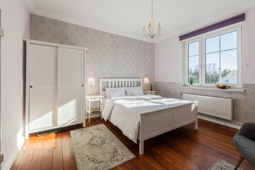 Ένα ή περισσότερα κρεβάτια σε δωμάτιο στο Hotel Villa Wahnfried Thiessow