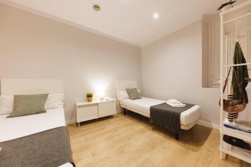 Katil atau katil-katil dalam bilik di Bravissimo Apartaments Mora 4