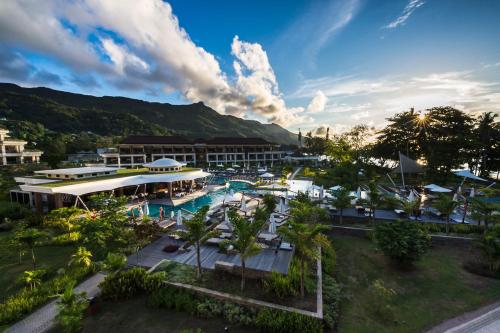 an aerial view of a resort with a swimming pool at Savoy Seychelles Resort & Spa in Beau Vallon
