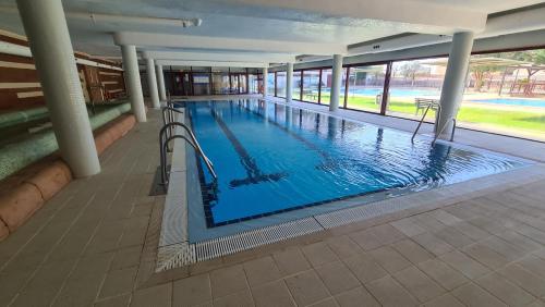 a large swimming pool in a building at SPA RELAX paradise in Villanueva de Río Segura