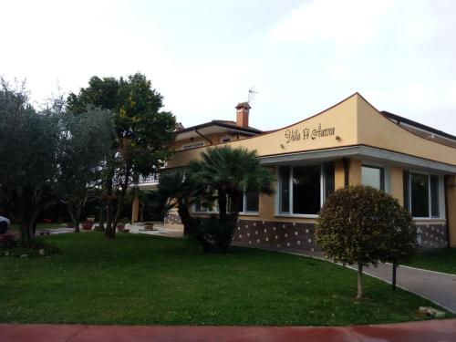 a building with a sign on the front of it at Hotel Villa Aurora in Latina