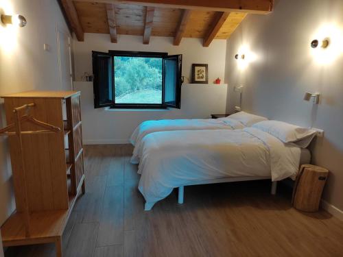 Postel nebo postele na pokoji v ubytování Mokorroko Borda Hostal Rural