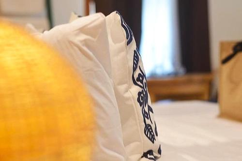 a white paper bag with blue designs on it at Sirom Beach House in Tambobong