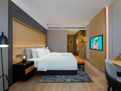 Ein Bett oder Betten in einem Zimmer der Unterkunft Park Inn by Radisson Nanjing North Zhongshan Road