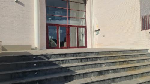 a staircase in front of a building with a red door at SPA RELAX paradise in Villanueva de Río Segura