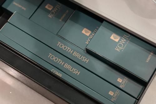 a close up of a cell phone screen with four books at Kowju Airport Hotel Calicut in Kondotti