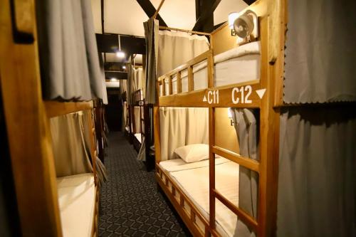 Ένα ή περισσότερα κρεβάτια σε δωμάτιο στο Chanthavong Hostel