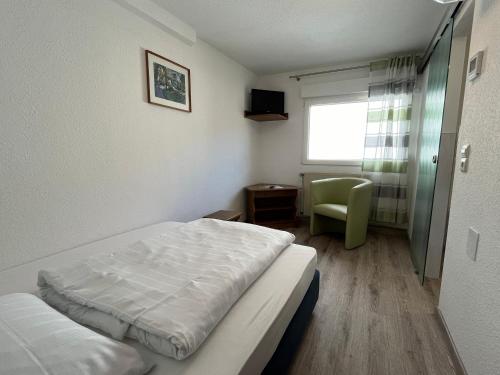 Ένα ή περισσότερα κρεβάτια σε δωμάτιο στο Hotel Rebstock