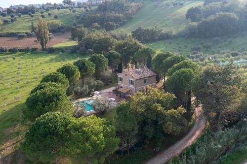 an aerial view of a house in a field at VILLA CHERUBINI 8&1, Emma Villas in Cingoli