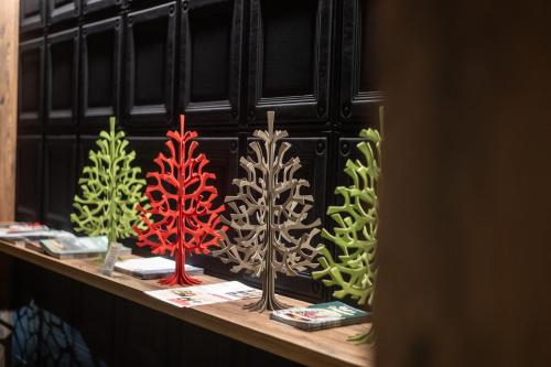 a display of trees on a shelf in a store at LA CHENEAUDIÈRE - Hôtel Spa - Relais & Châteaux - Restaurant étoilé in Colroy-la-Roche
