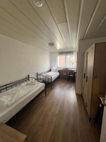 a room with two beds and a couch in it at Era Singles in Murg