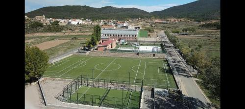 an aerial view of a tennis court in a field at Casa la Cisterna in Pina de Montolgrao