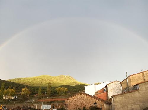 a town with a mountain in the background at Casa la Cisterna in Pina de Montolgrao