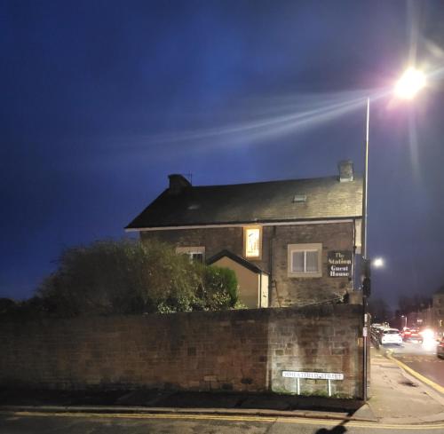 a house on a street with a street light at Station Guesthouse - key pad entry with parking in Lancaster