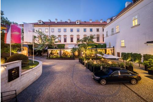 a black car parked in front of a building at Mandarin Oriental, Prague in Prague