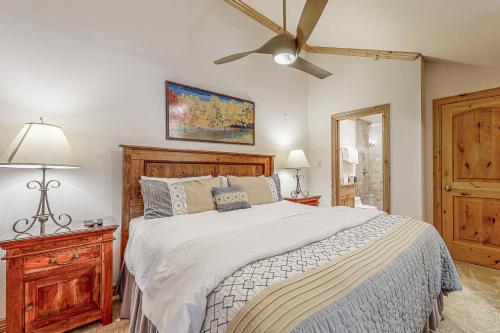 a bedroom with a bed and a ceiling fan at Lion Square Lodge South 554 in Vail