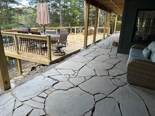 a patio with a table and chairs on a house at Paradox Lakeside in Paradox