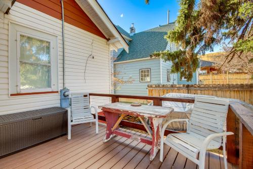 a wooden deck with a table and chairs on a house at Downtown Red Lodge Home - 8 Mi to Skiing! in Red Lodge