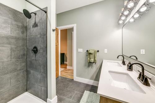 a bathroom with two sinks and a shower at Brantingham Home ATV and Snowmobile Trails On-Site! in Glenfield