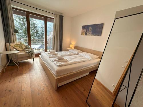 Postel nebo postele na pokoji v ubytování Family Apartment HIRSCH