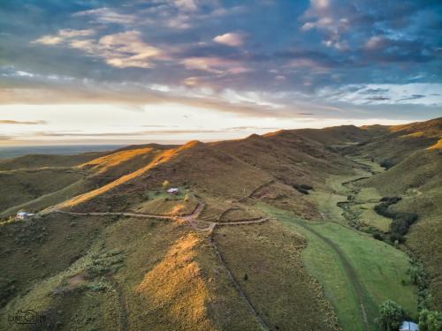 an aerial view of a golf course on a mountain at Estancia Altos del Durazno in Estancia Grande
