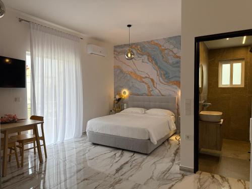 a bedroom with a bed and a painting on the wall at Madi Luxury Stay Patra in Patra