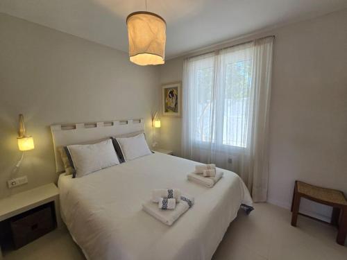 Ένα ή περισσότερα κρεβάτια σε δωμάτιο στο Casa Oasis by Sesimbra Sun Sea