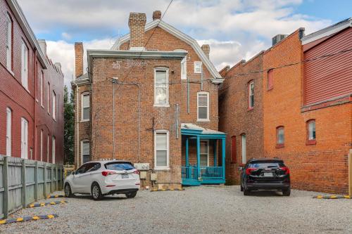 two cars parked in front of a brick building at G3 central location museums FREE PARKING in Richmond