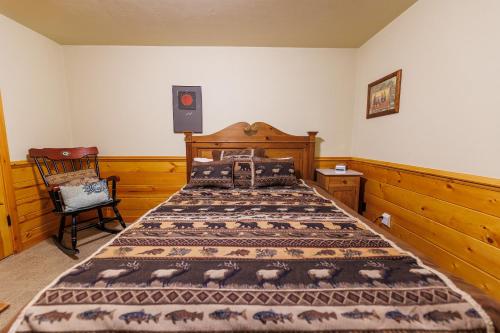 a bedroom with a bed and a speaker in it at Log Retreat at Fish Creek by Simple Life Rentals in Fish Creek