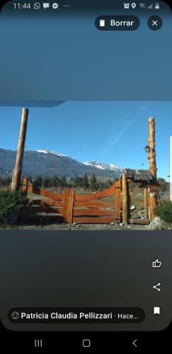 a screenshot of a picture of a wooden fence at Cabañas SurEnya in El Bolsón