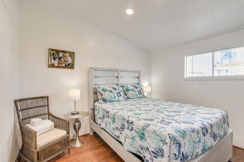 a bedroom with a bed and a chair and a window at Oceanfront Galveston Home on Terramar Beach in Galveston