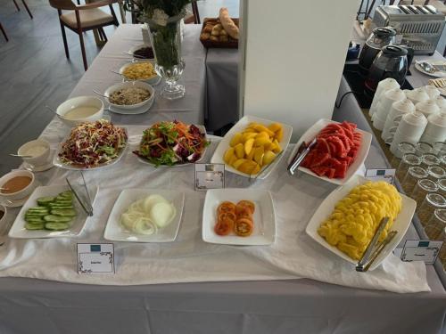 a table with many different types of food on it at Homewood Hotel By Seuya Hotel in Siem Reap