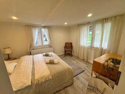 a bedroom with a bed with two towels on it at Bijou N 2 Lungern in Lungern