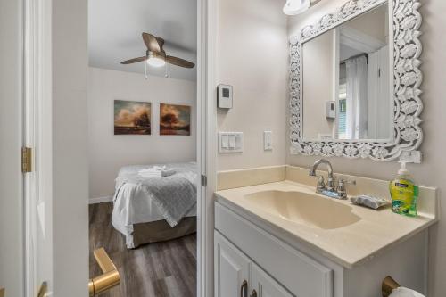 a bathroom with a sink and a mirror at Prosecco by Simple Life Rentals in Fish Creek